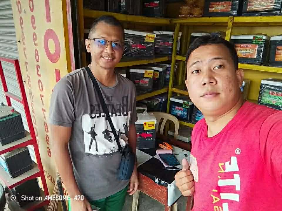 Smiling client next to car